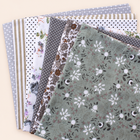 Grey cotton fabric bundle — seven 25 cm squares on cream