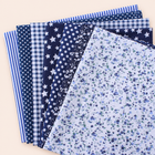 Navy cotton fabric bundle — seven 25 cm squares on cream