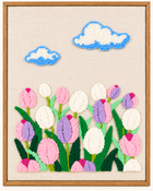 Tulips punch needle design in a wood-look frame — close-up front view