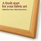 Close-up of the wood-look frame and pale yellow adhesive backing