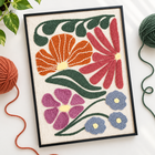 Garden Medley — finished DIY punch needle project in black frame